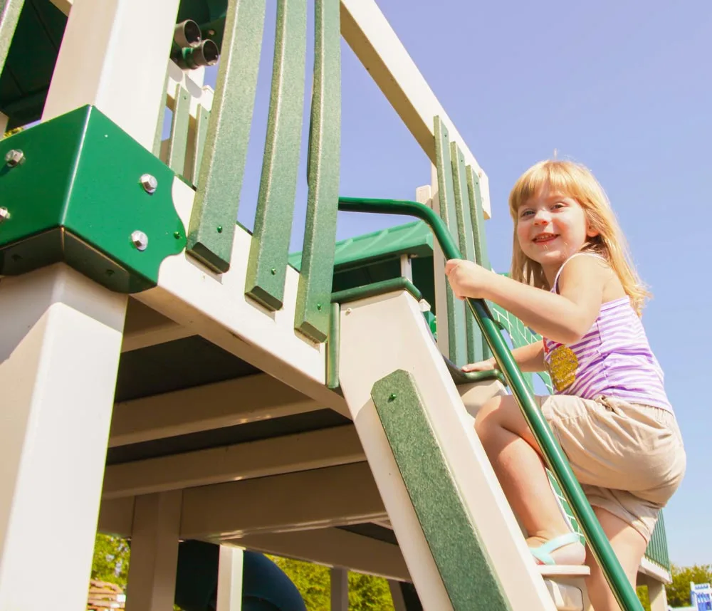 child playing on vinyl play set