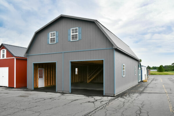 Two story Two-car garage with dutch roof with dark gray siding